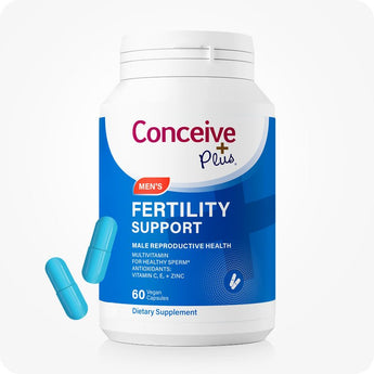 For Conceive Plus Maximum Fertility Bundle, image of men's fertility support supplement bottle shown in blue and white packaging, labeled for male reproductive health with 60 vegan capsules, accompanied by two bright blue capsules displayed beside container for visual clarity.
