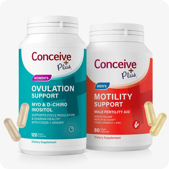 For Conceive Plus Motility and Ovulation Support Bundle showing two labeled supplement bottles—one in teal for women's ovulation support and one in red for men’s motility support—each with bold branding and visible capsules scattered near the base, photographed against a white background to emphasize packaging and gender-specific formulation.